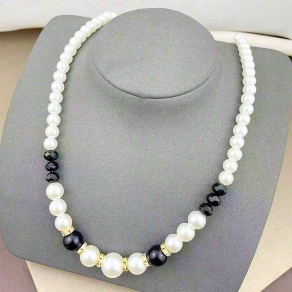 Black and white necklace faux pearls .